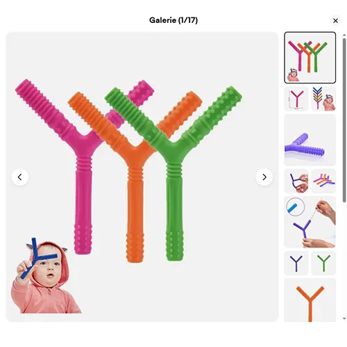 Jucărie de dentiție din plastic moale violet în formă de litera Y, cu diferite texturi. Produs vândut online, în special prin intermediul eBay (identificator unic: 197497295169).