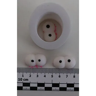 Jucărie stoarsă &icirc;n formă de omidă cu ochi mari.