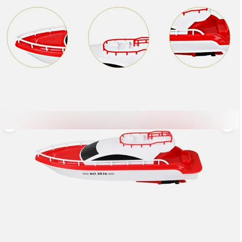Jucărie de baie &icirc;n formă de barcă de plastic roșie și albă, cu două motoare cu elice care necesită o baterie fiecare. Produs v&acirc;ndut online, &icirc;n special prin intermediul eBay (identificator unic: 127095230458).